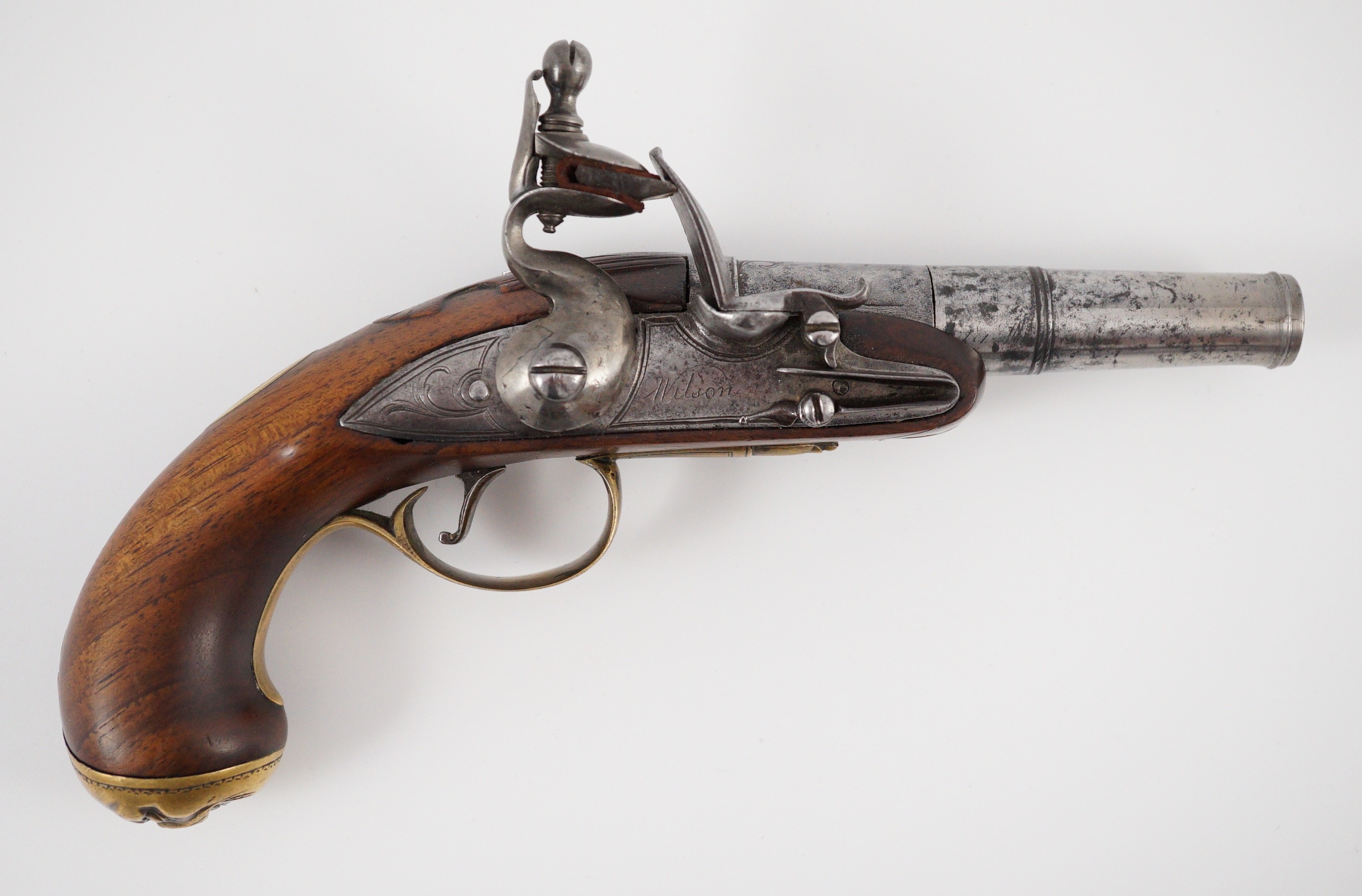 Wilson of London. An early 18th century flintlock pocket pistol, 11cm high 19cm long